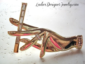 Vintage Art Deco And Art Nouveau Ladies Fashion Hand Holding A Cigarette Pin Brooch.